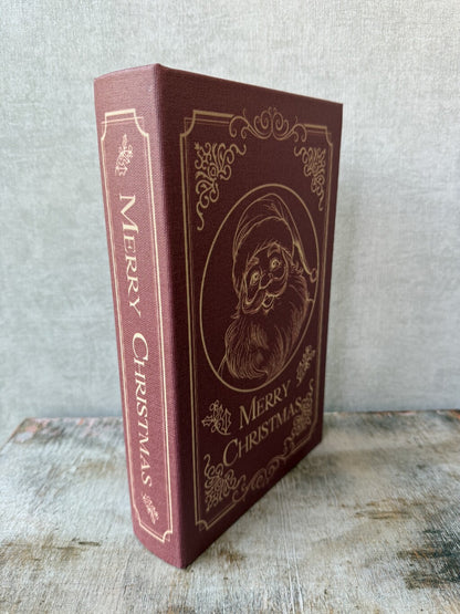 Rood Opbergboek Santa van HomeBound met gouden kerstman en Merry Christmas opdruk.